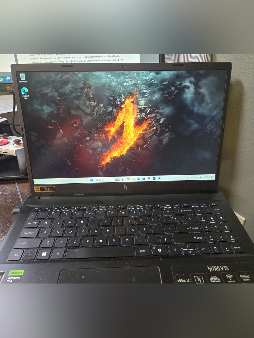 Acer Nitro V15 Black Gaming Laptop with Orange Accent on Display